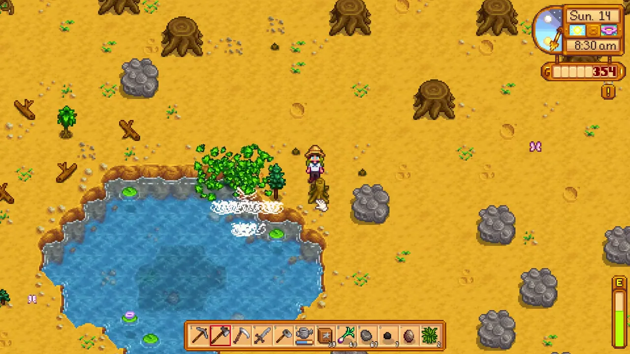Stardew Valley: Tree drops beside a farm pond